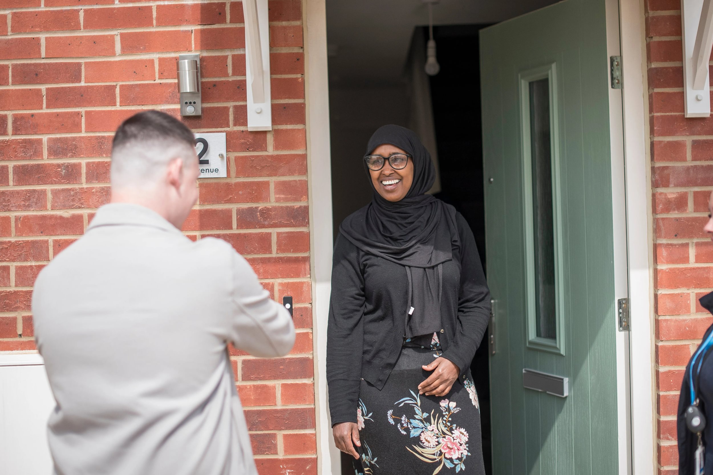 Woman Doorway Smiling