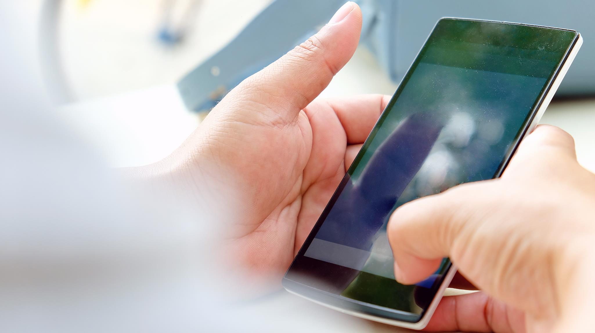 A close-up of someone holding a smartphone