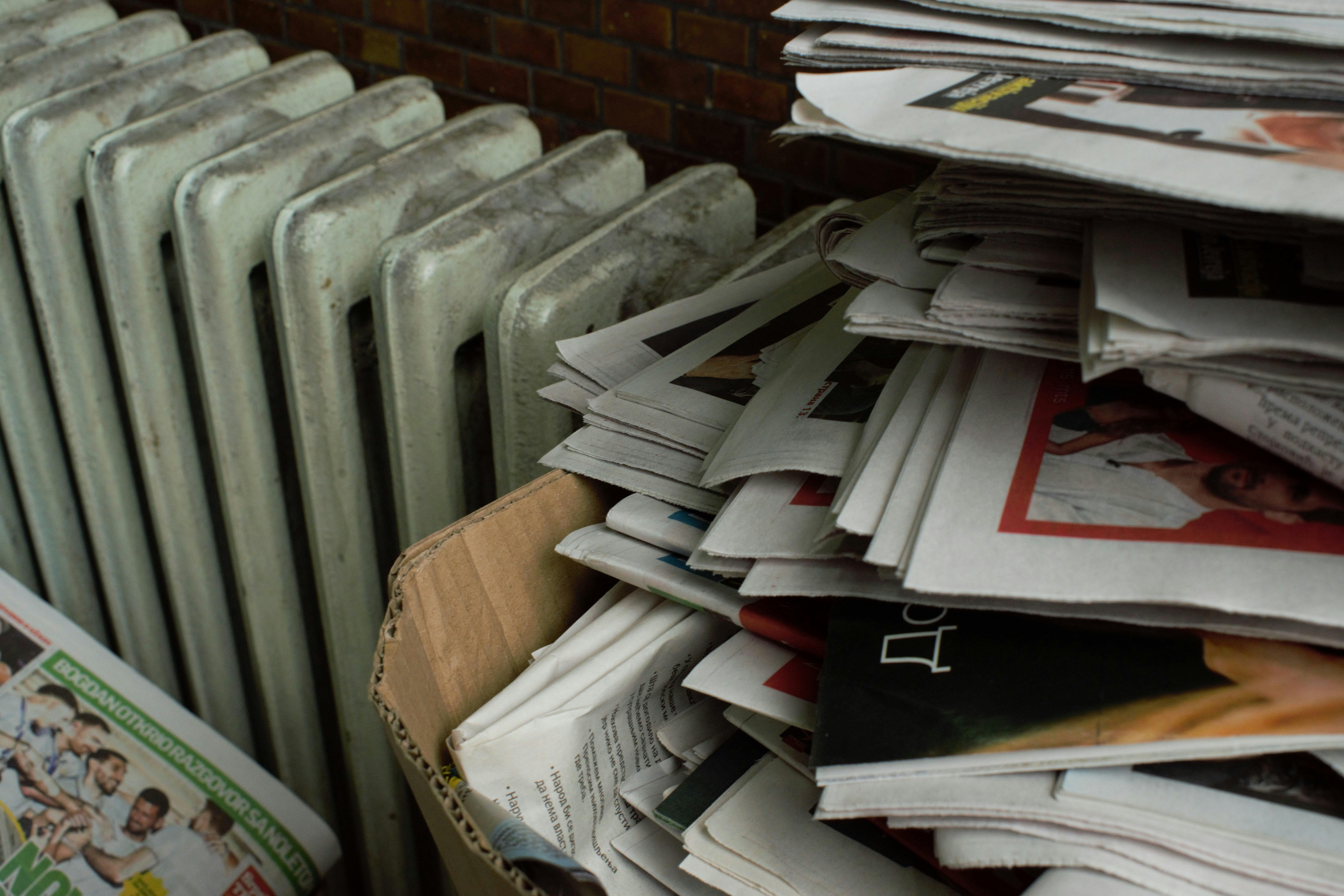 An untidy stack of newspapers