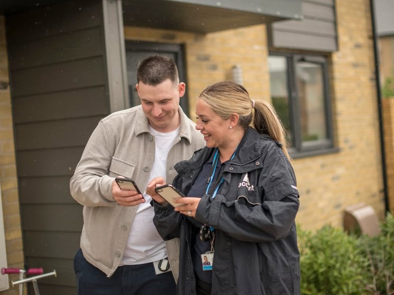 Two Housing Partners Working Outside