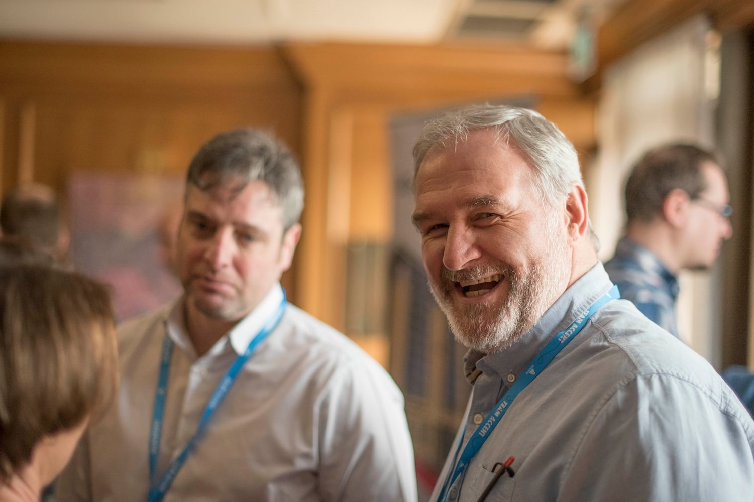 Colleague Laughing At Camera During Event