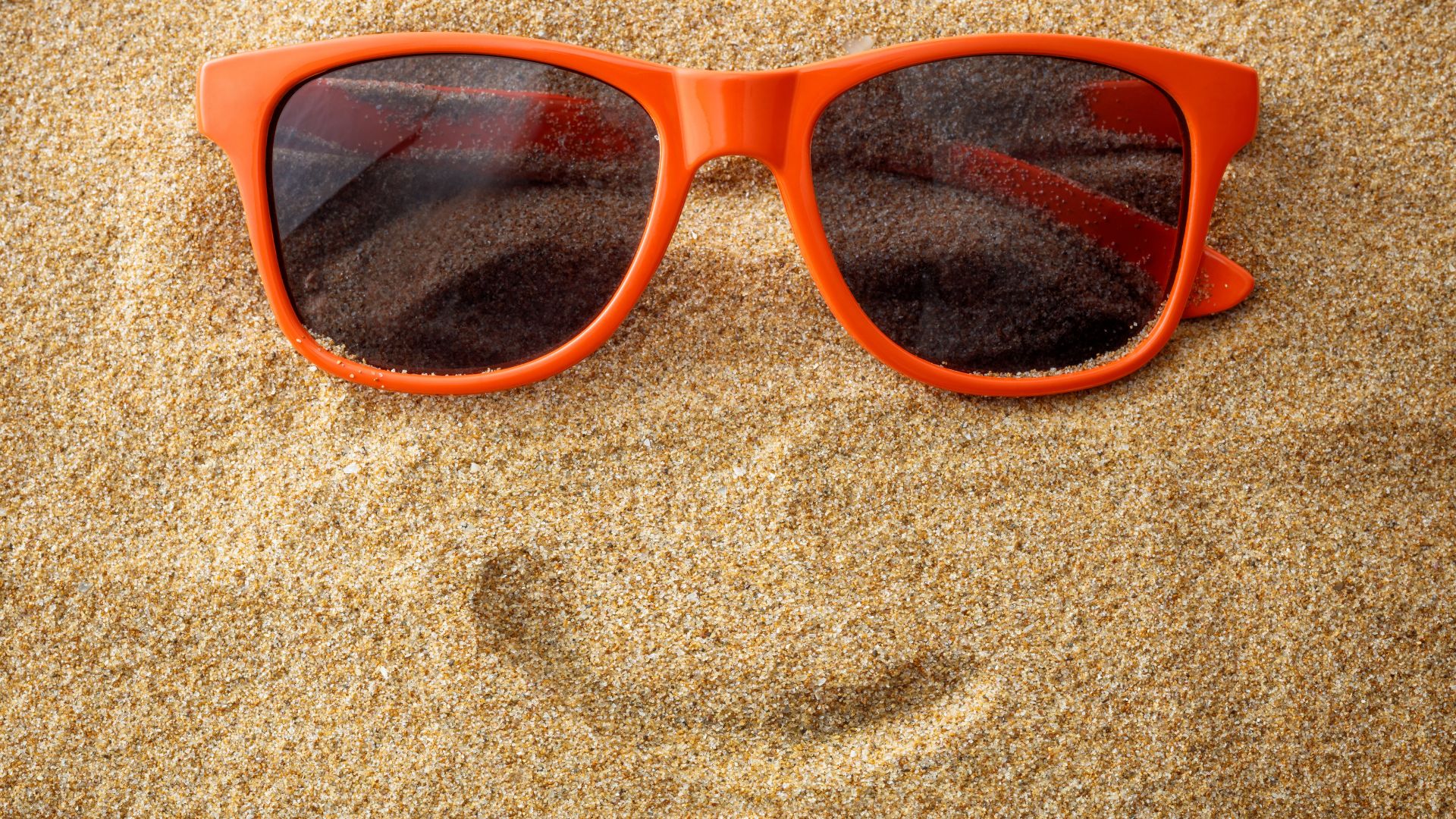 Sunglasses And Smile On Sand