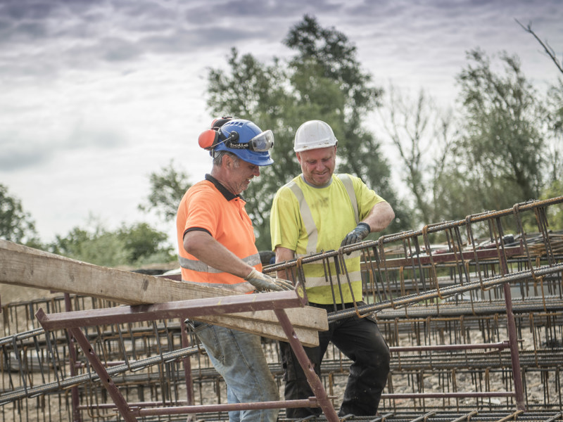 Two Workmen On Building Site